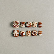 Discover the 4pm press on nails, showcasing adorable nail art designs inspired by sweet treats. With a matte finish, these nails are perfect for everyday wear, adding a touch of fun and style to your look.