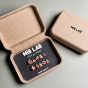 A set of Handmade press on nails with playful donut and sprinkle designs, presented in eco-friendly packaging. These Custom press on nails offer a fun and whimsical look, perfect for Everyday nails with a unique touch. The box, labeled "MIB LAB" and "Meet Your Moment", highlights the brand's dedication to creating personalized Nail art designs. Ideal for those seeking Reusable fake nails that combine style and creativity.