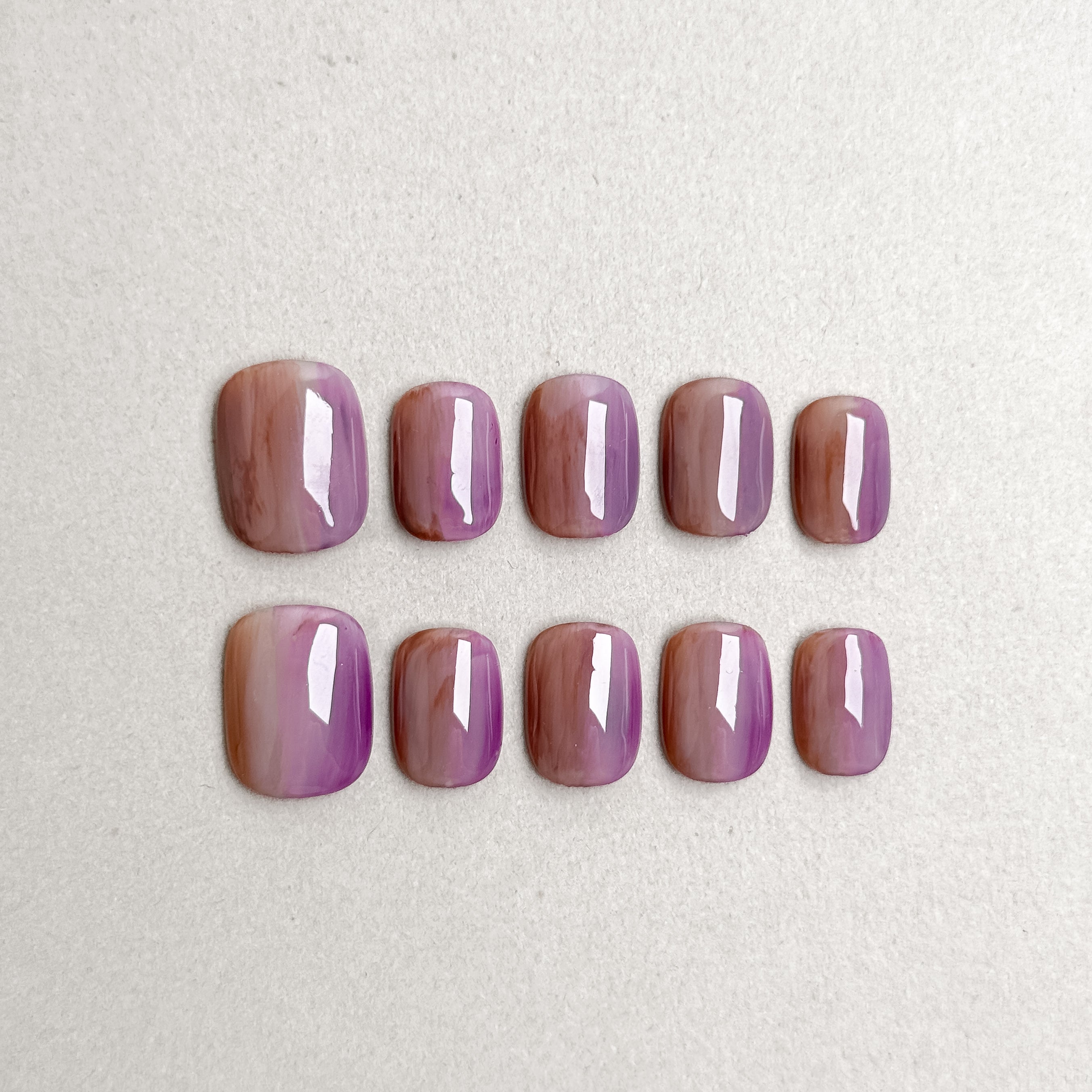 Set of reusable press-on nails in mauve purple with glossy finish, MIBLAB Emoi collection Geneva.