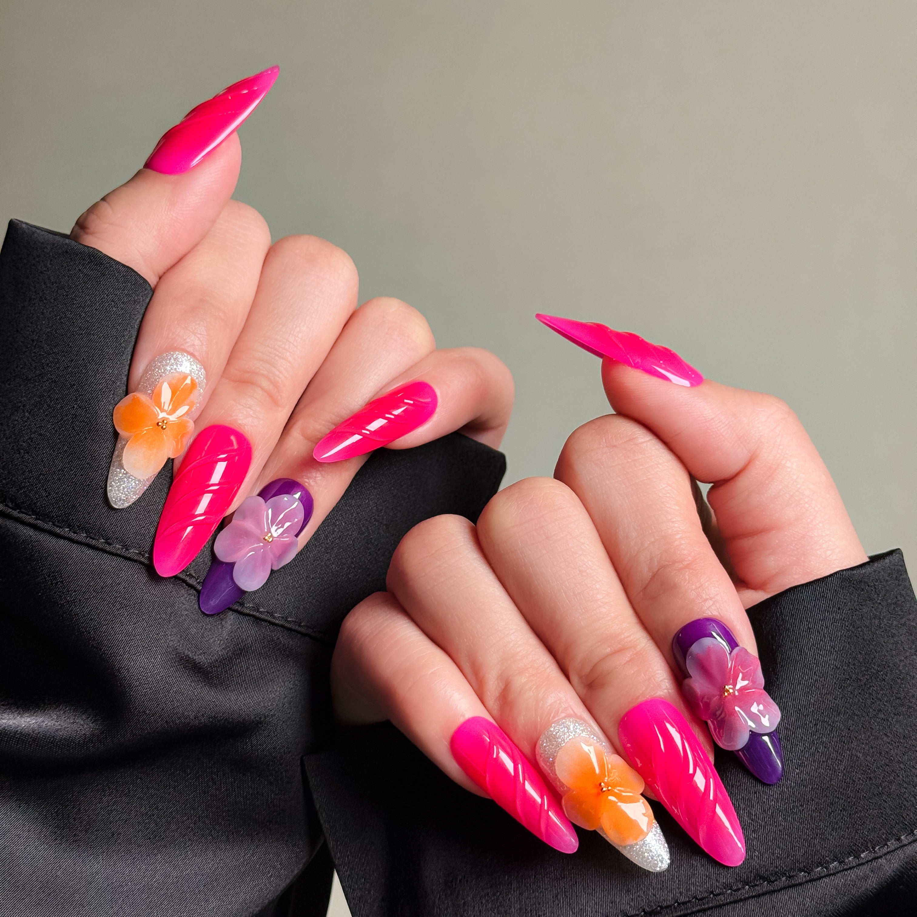 Elegant Stiletto nails featuring vibrant pink hues and floral accents. These Custom press on nails offer a bold and feminine look perfect for Party nails or special occasions. The elongated shape and intricate detailing accentuate the artistry of these Handmade press on nails. Perfect for those seeking Luxury press on nails that are both stylish and eye-catching.