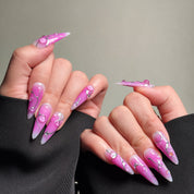 Elegant Stiletto nails featuring a vibrant purple design with abstract lines and silver accents. These Custom press on nails offer a bold and artistic look, perfect for Party nails or special occasions. The elongated shape and intricate details highlight the artistry of these Handmade press on nails. Ideal for those seeking Luxury press on nails that make a statement.