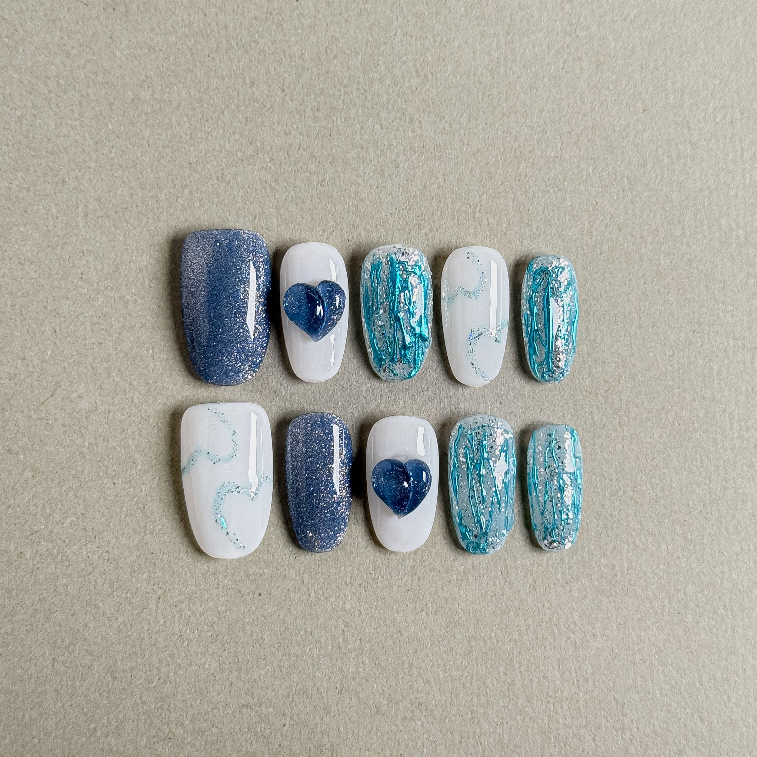 Relaxing Blue Vacay press on nails with a serene blue and white color scheme and charming heart embellishments, featuring Nail art designs and Minimalist nails, perfect for Holiday nails