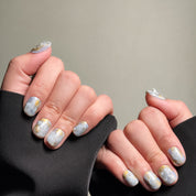 Elegant Almond nails featuring a delicate marble and gold foil design, creating a sophisticated and luxurious look. These Custom press on nails are perfect for Wedding nails or special occasions, showcasing intricate Nail art designs. The soft, muted tones make them suitable for both everyday wear and formal events. Ideal for those seeking Luxury press on nails that combine style and elegance.