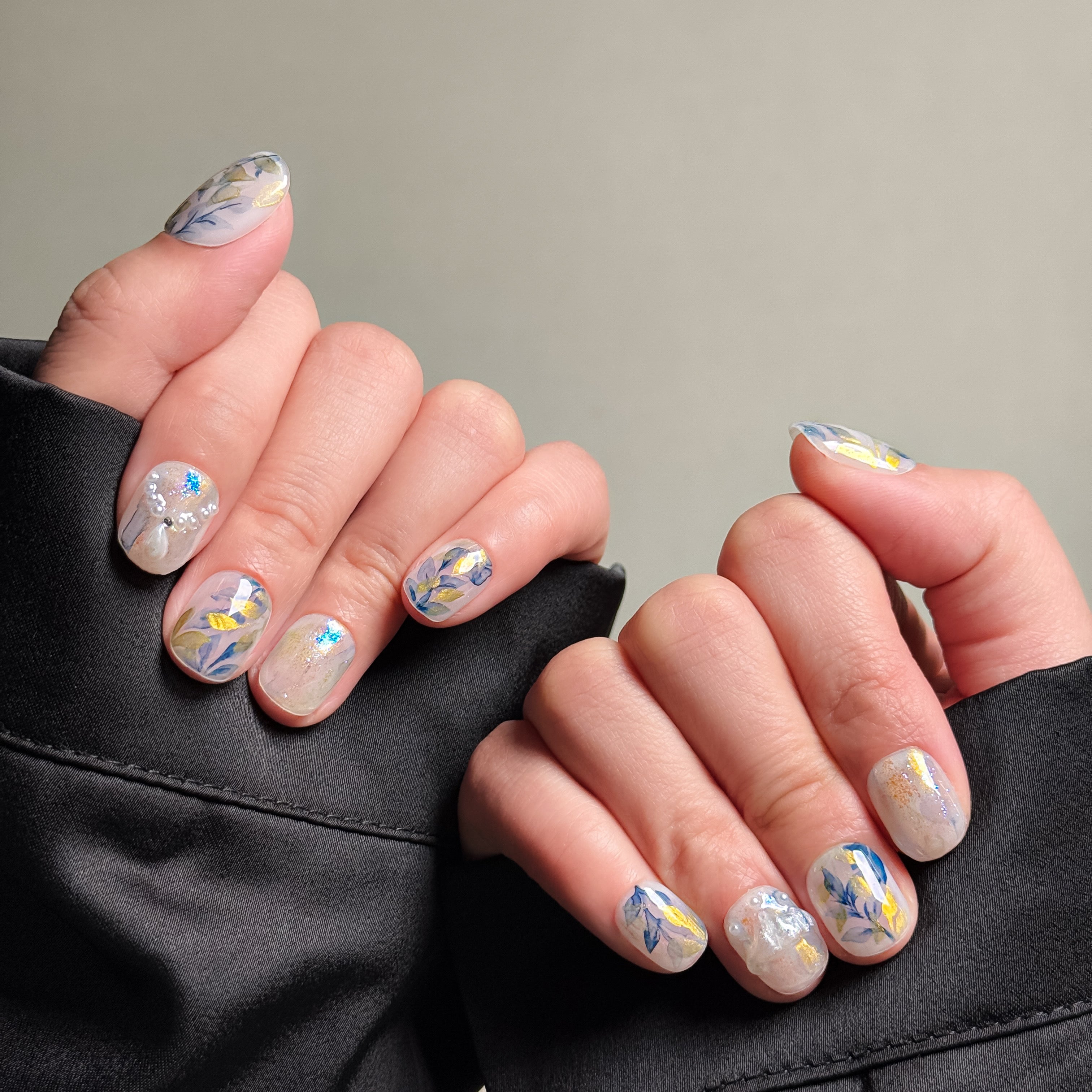 Elegant Oval nails featuring a delicate floral design on a light blue base. These Floral nails offer a fresh and sophisticated look, perfect for Everyday nails with a touch of elegance. The intricate details and soft colors make them ideal for both casual and formal occasions. Ideal for those seeking Luxury press on nails that are both stylish and versatile.