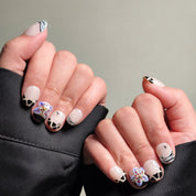 Elegant Almond nails with delicate floral and abstract black and white designs.  Features a 3D purple flower accent on one nail, showcasing intricate Nail art designs. Perfect for Party nails or special occasions, these Custom press on nails offer a unique and luxurious look.