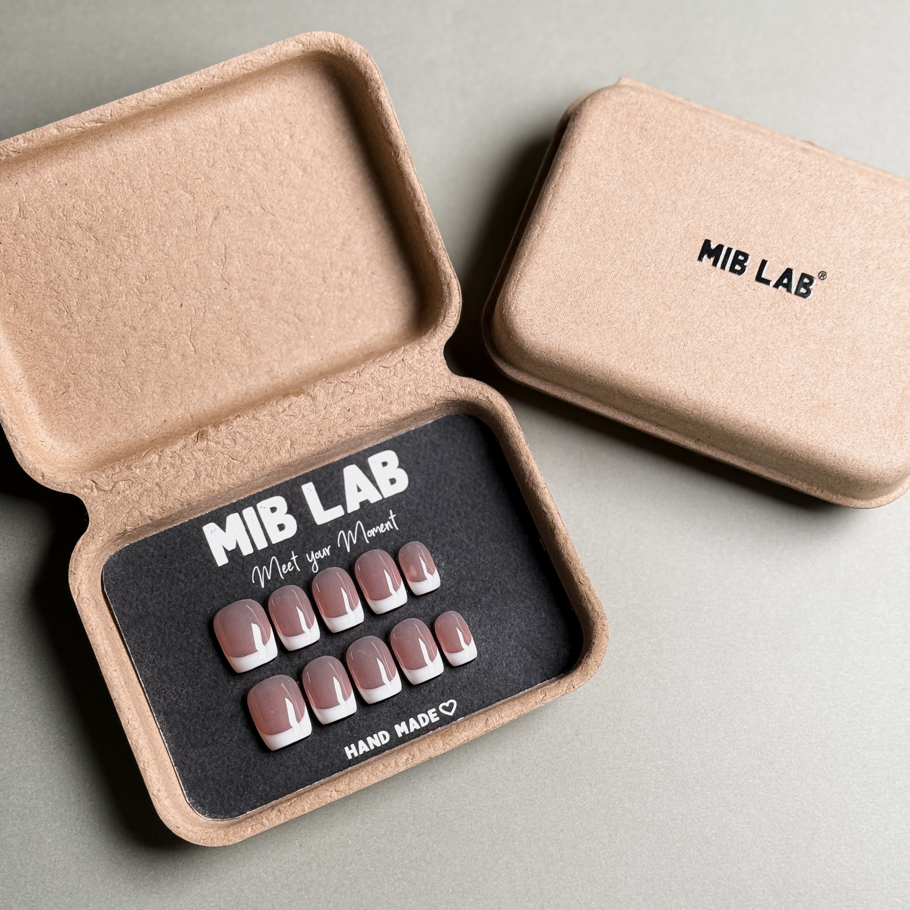 MIBLAB's French tip nails set with a classic design, packaged in an eco-friendly box. Features clean white tips and a neutral base, ideal for everyday nails. Offers a luxury press on nails experience with handmade press on nails. Perfect for achieving natural looking nails with professional nail art quality.