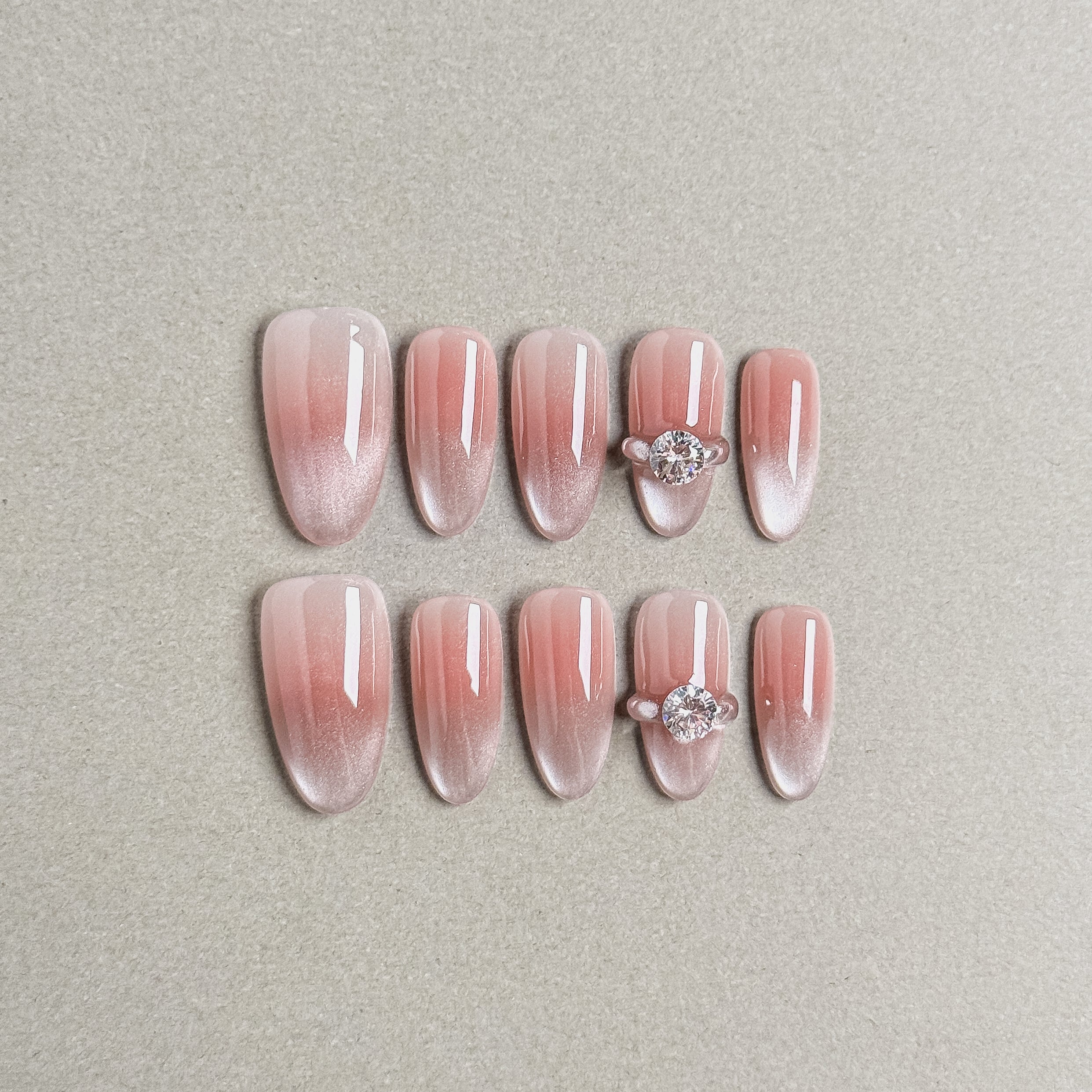 A set of "My Day" press - on nails with a soft pink gradient and glitter, accentuated by elegant rhinestone embellishments on two nails, ideal for adding a touch of glamour to wedding - themed nail styles.