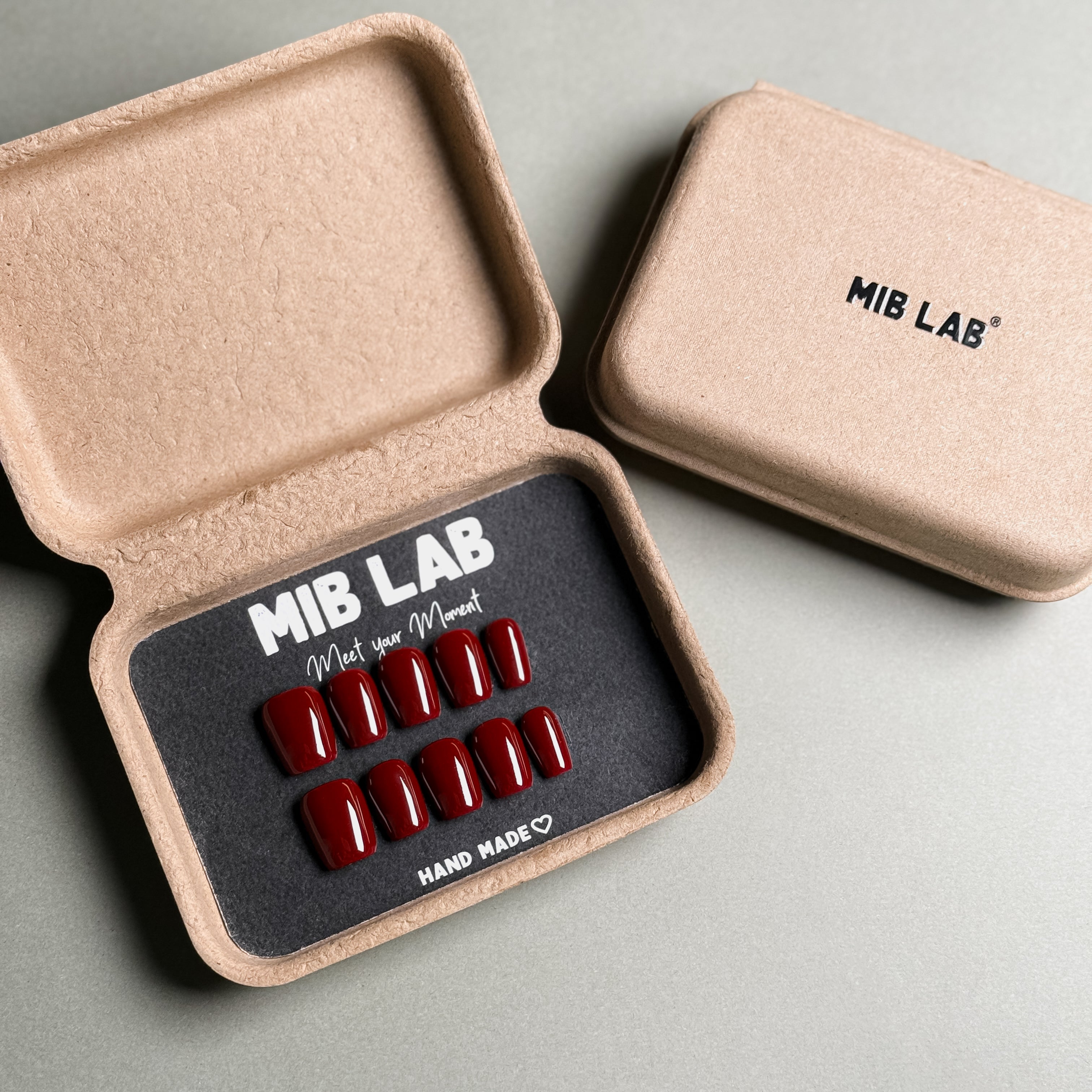 Handmade luxury press-on nails in deep red, elegantly packaged in an eco-friendly MIB LAB box. Reusable coffin nails for a sophisticated, salon-quality look. Perfect for professional nail art, party nails, and everyday elegance.