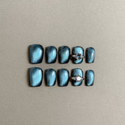 Gorgeous Stormy press on nails with a sleek, shimmering teal finish and a diamond ring accent, featuring Luxury press on nails and Glitter nails, perfect for Wedding nails