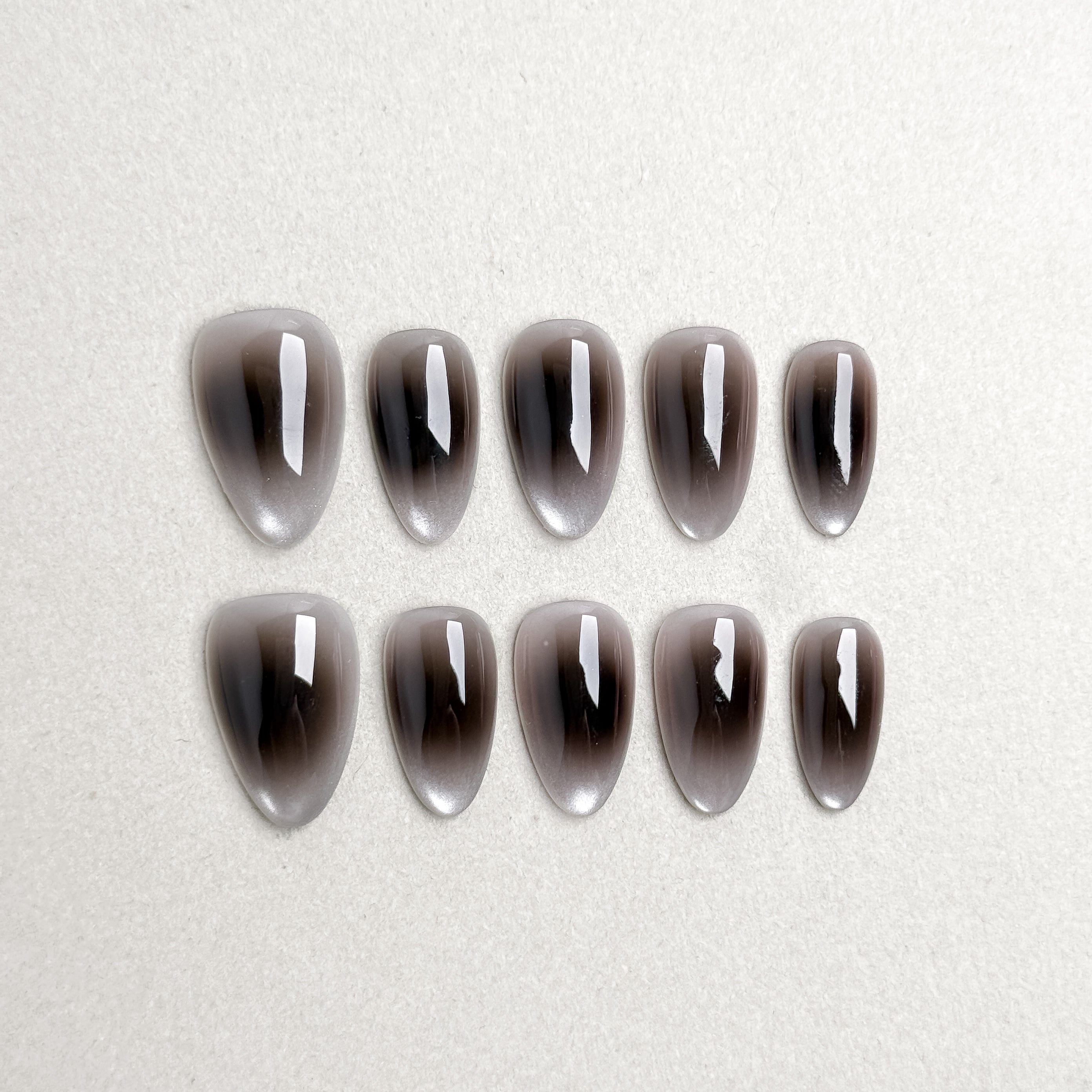 Set of reusable press-on nails in metallic silver-gray chrome finish, MIBLAB Raw collection Geneva.