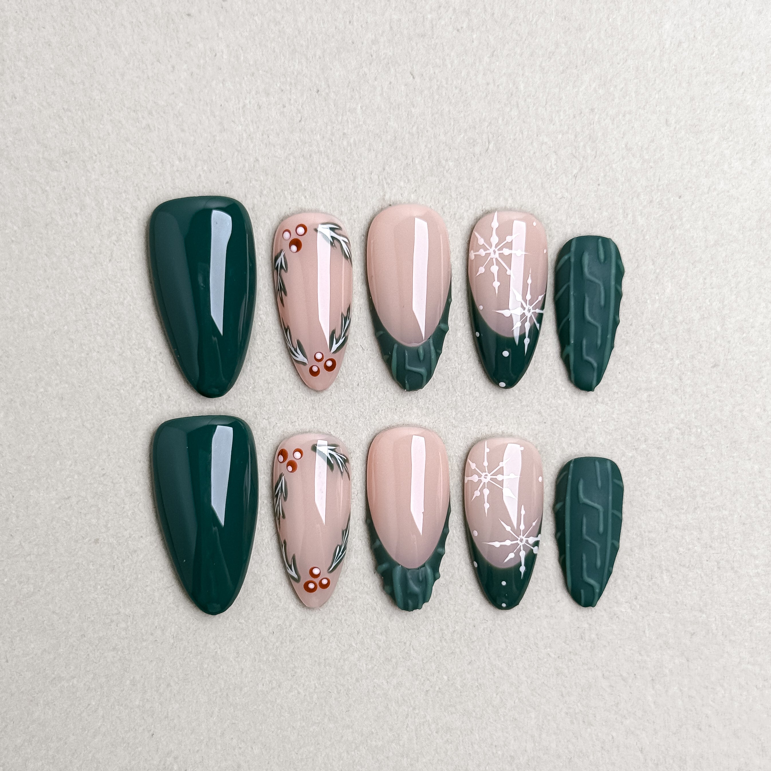 Set of reusable press-on nails in deep forest green and nude beige with floral accents, MIBLAB Under My Tree collection Geneva.